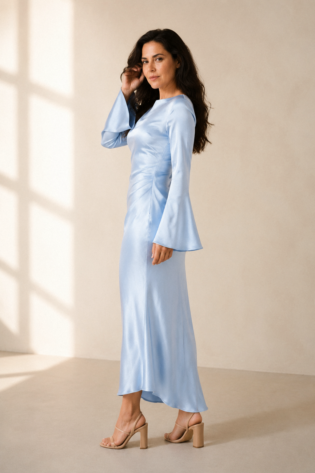 Light blue silk column maxi dress, three-quarter view, silk fabric movement and drape