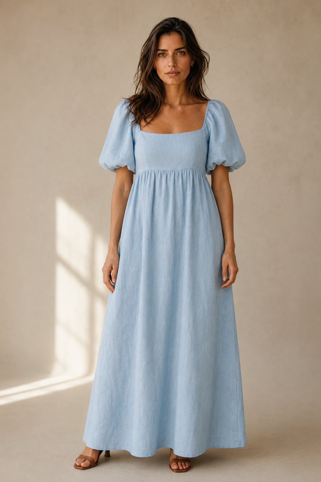 Light blue linen a-line maxi dress, full front view, gathered empire waist, flowing skirt