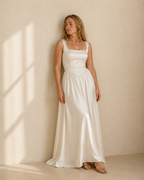 Ivory satin a-line maxi dress, front view on model, square neckline, basque waist, gathered skirt