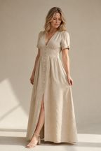 Light beige linen a-line maxi dress, three-quarter view, defined waist and flowing skirt
