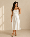 Ivory satin a-line midi dress, front view on model, straight neckline, spaghetti straps, seamed bodice, A-line skirt