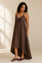 Brown linen slip maxi dress, three-quarter view, fluid silhouette and asymmetrical hemline