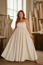 Ivory linen a-line maxi dress, lifestyle, quiet moment in warm light