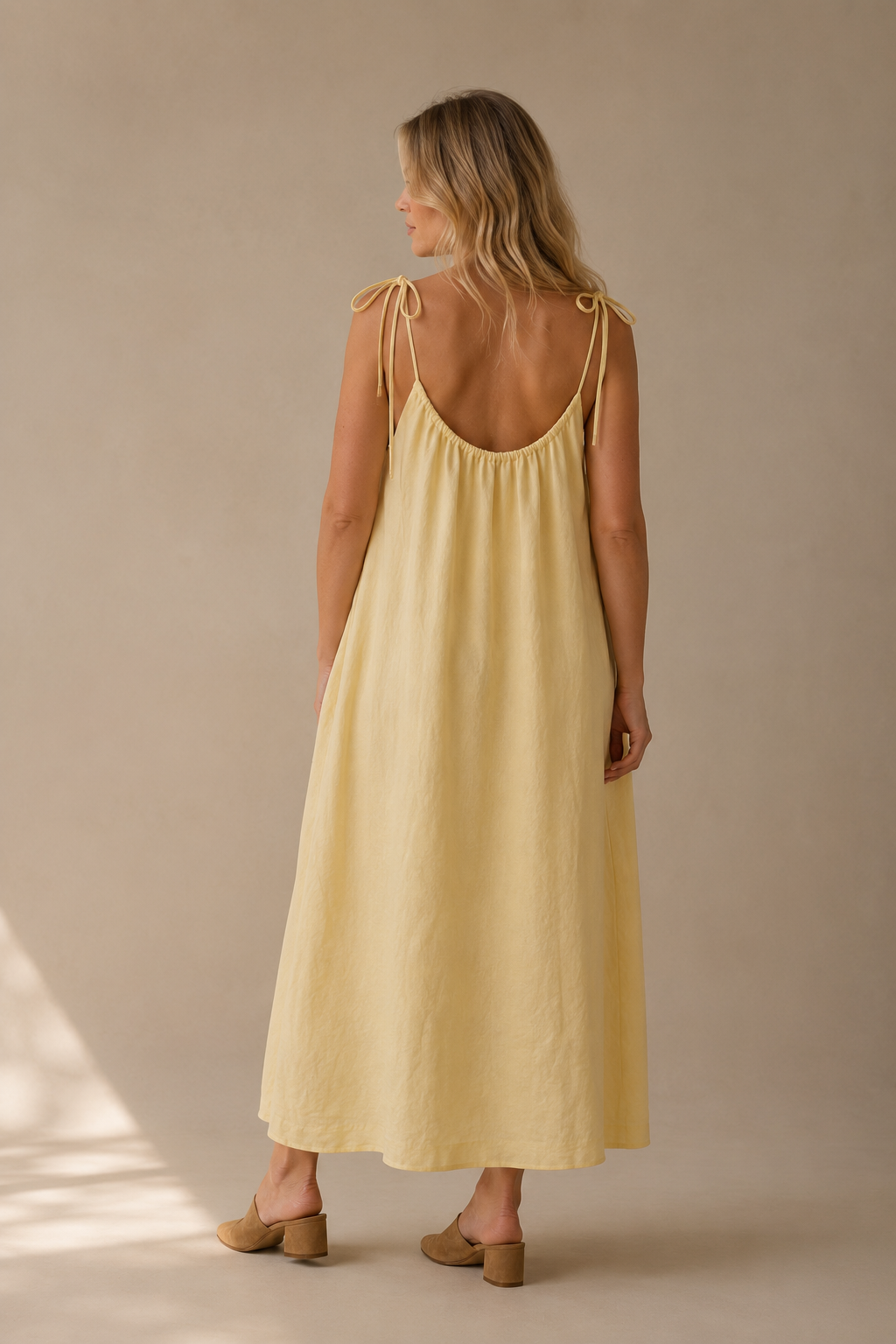 Pale yellow linen shift maxi dress, back view, loose fit, simple back