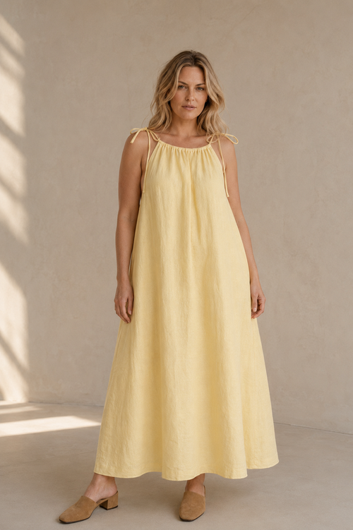 Pale yellow linen shift maxi dress, full front view, relaxed shift silhouette, maxi length