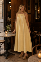 Pale yellow linen shift maxi dress, lifestyle, sunny steps, relaxed posture