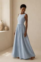 Light blue linen a-line maxi dress, three-quarter view, full skirt drape and soft fabric