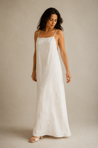 Ivory linen slip maxi dress, three-quarter view, fluid column silhouette