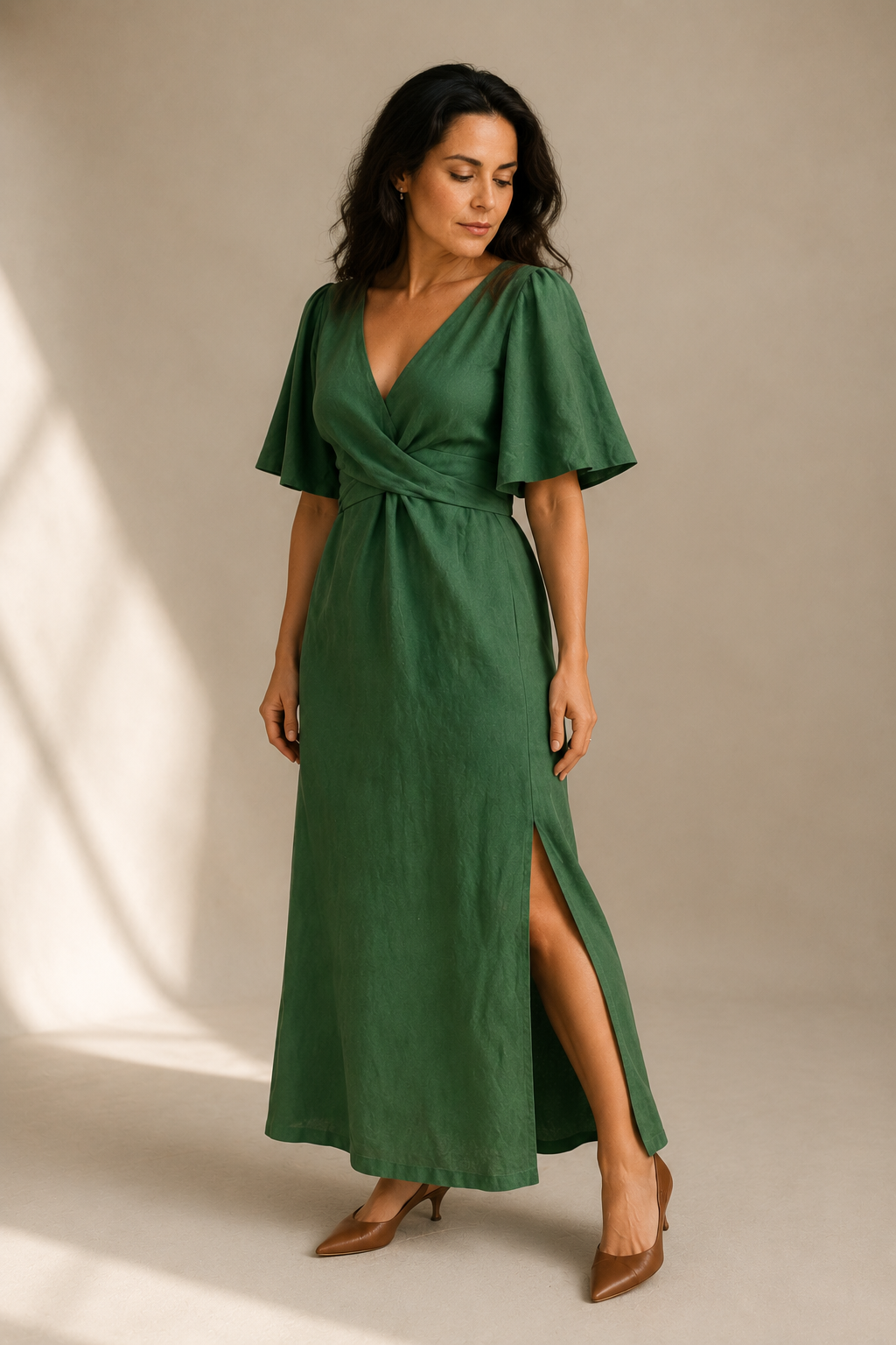 Green linen wrap maxi dress, three-quarter view, wrap tie waist, relaxed sleeves, maxi skirt