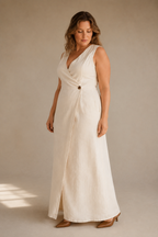 Ivory linen wrap maxi dress, three-quarter view, wrap closure and full skirt drape