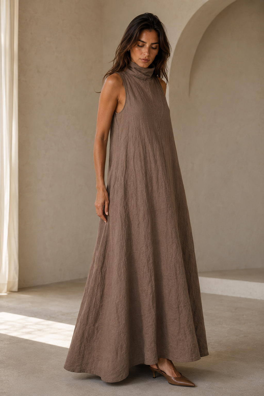 Taupe linen a-line maxi dress, three-quarter view, relaxed fit, gentle skirt movement