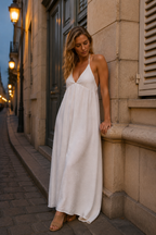 White cotton shift maxi dress, front view, halter V neckline and flowing silhouette