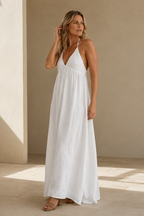 White cotton shift maxi dress, three-quarter view, flowing skirt and light fabric