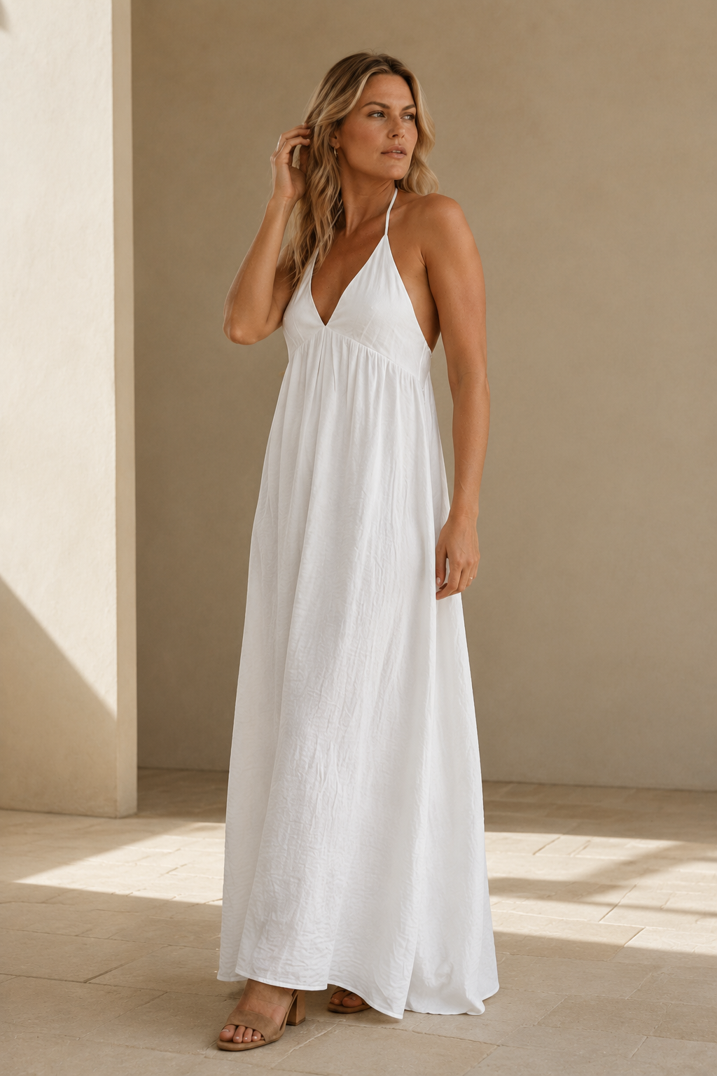 White cotton shift maxi dress, three-quarter view, flowing skirt and light fabric
