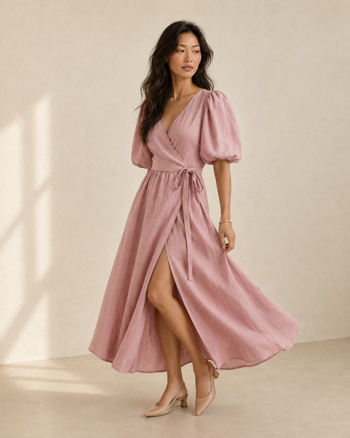 Dusty rose linen wrap midi dress, front view on model, v-neck wrap bodice, puff sleeves, tie waist