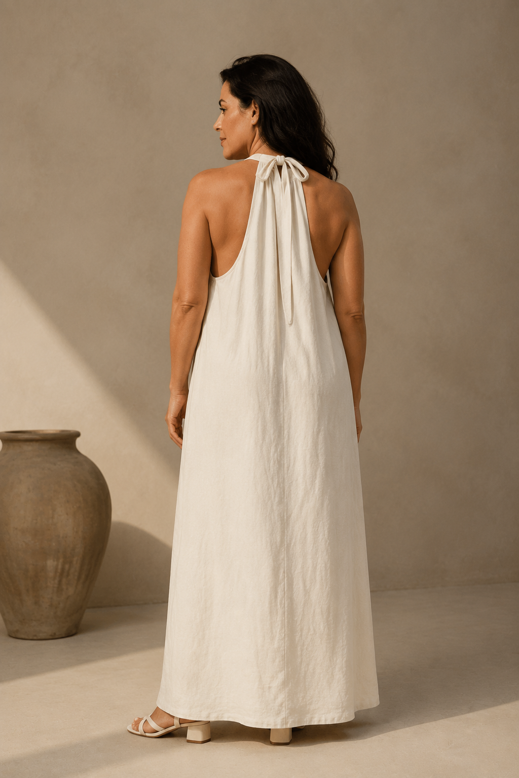 Ivory linen shift maxi dress, back view, halter back and straight fit