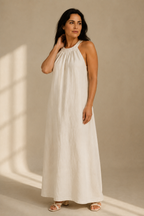 Ivory linen shift maxi dress, three-quarter view, flowing linen drape and silhouette
