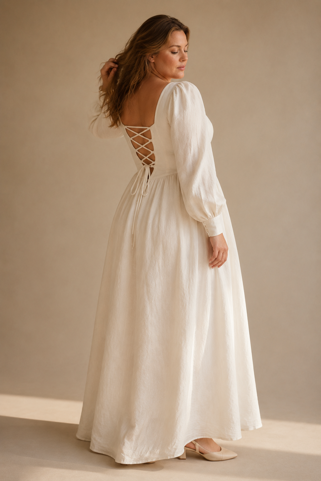 Ivory linen a-line maxi dress, three-quarter view, voluminous sleeves and gathered skirt