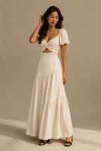 Ivory linen tiered maxi dress, full front view, v-neckline, puff sleeves, flowing skirt