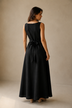 Black linen a-line maxi dress, back view, sleeveless, boat neckline, full skirt