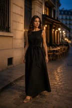 Black linen a-line maxi dress, lifestyle, warm light, ancient architecture, relaxed pose