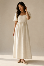Ivory linen a-line maxi dress, full front view, square neckline, puff sleeves, flowing maxi skirt