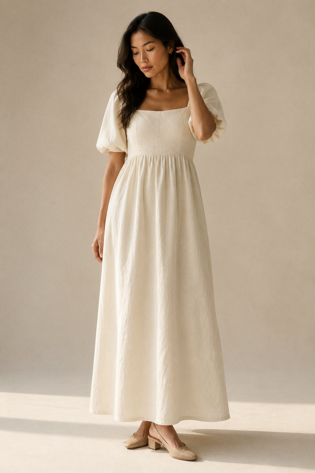 Ivory linen a-line maxi dress, full front view, square neckline, puff sleeves, flowing maxi skirt