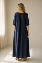 Navy blue linen a-line maxi dress, back view, relaxed fit and long drape