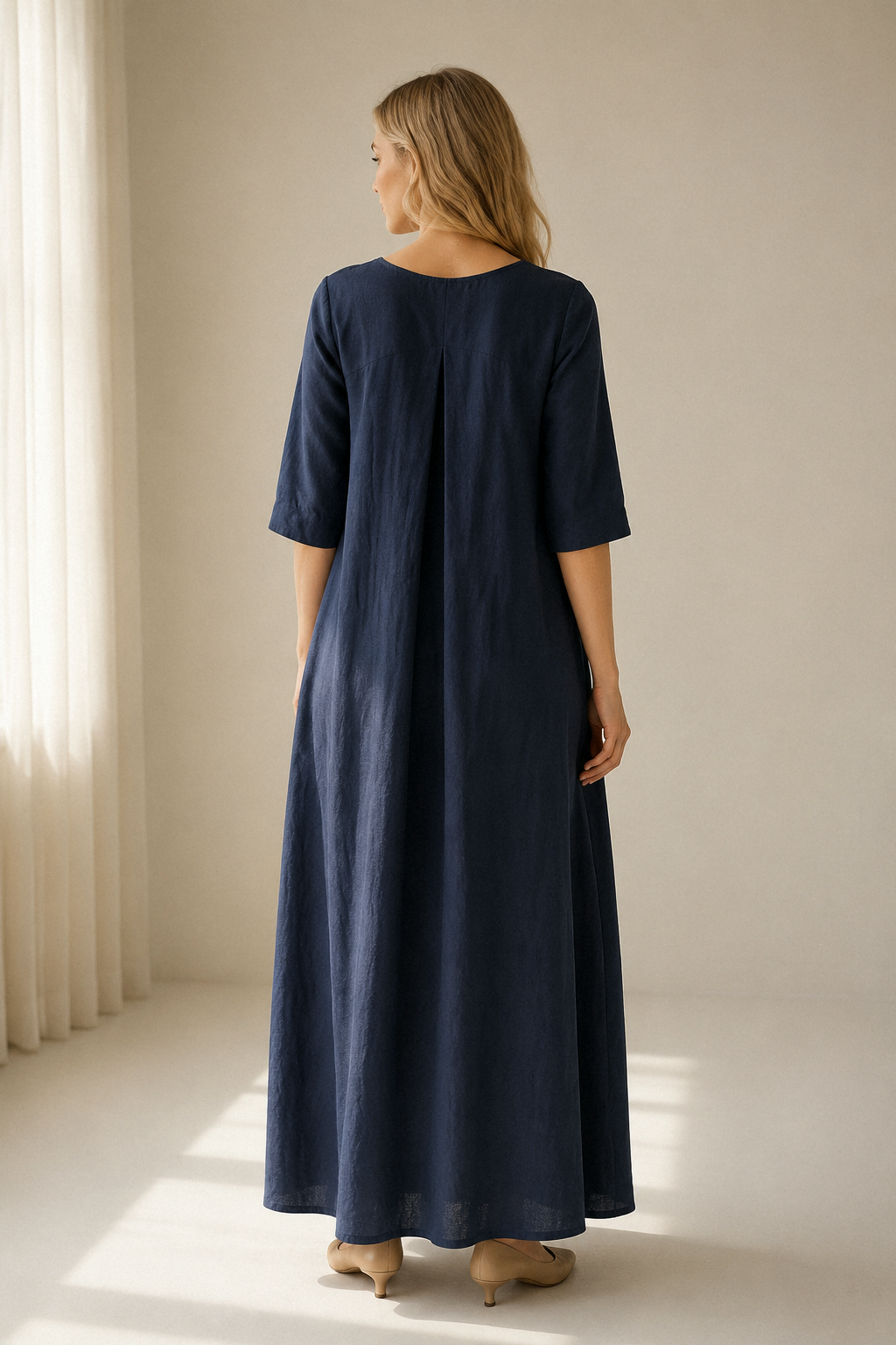 Navy blue linen a-line maxi dress, back view, relaxed fit and long drape