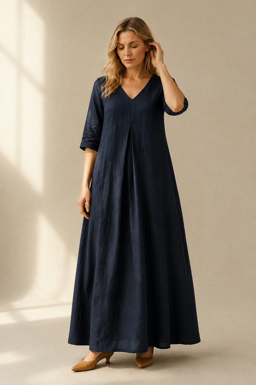 Navy blue linen a-line maxi dress, full front view, pleated front and side pockets