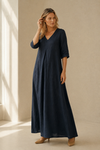 Navy blue linen a-line maxi dress, three-quarter view, flowing linen maxi dress