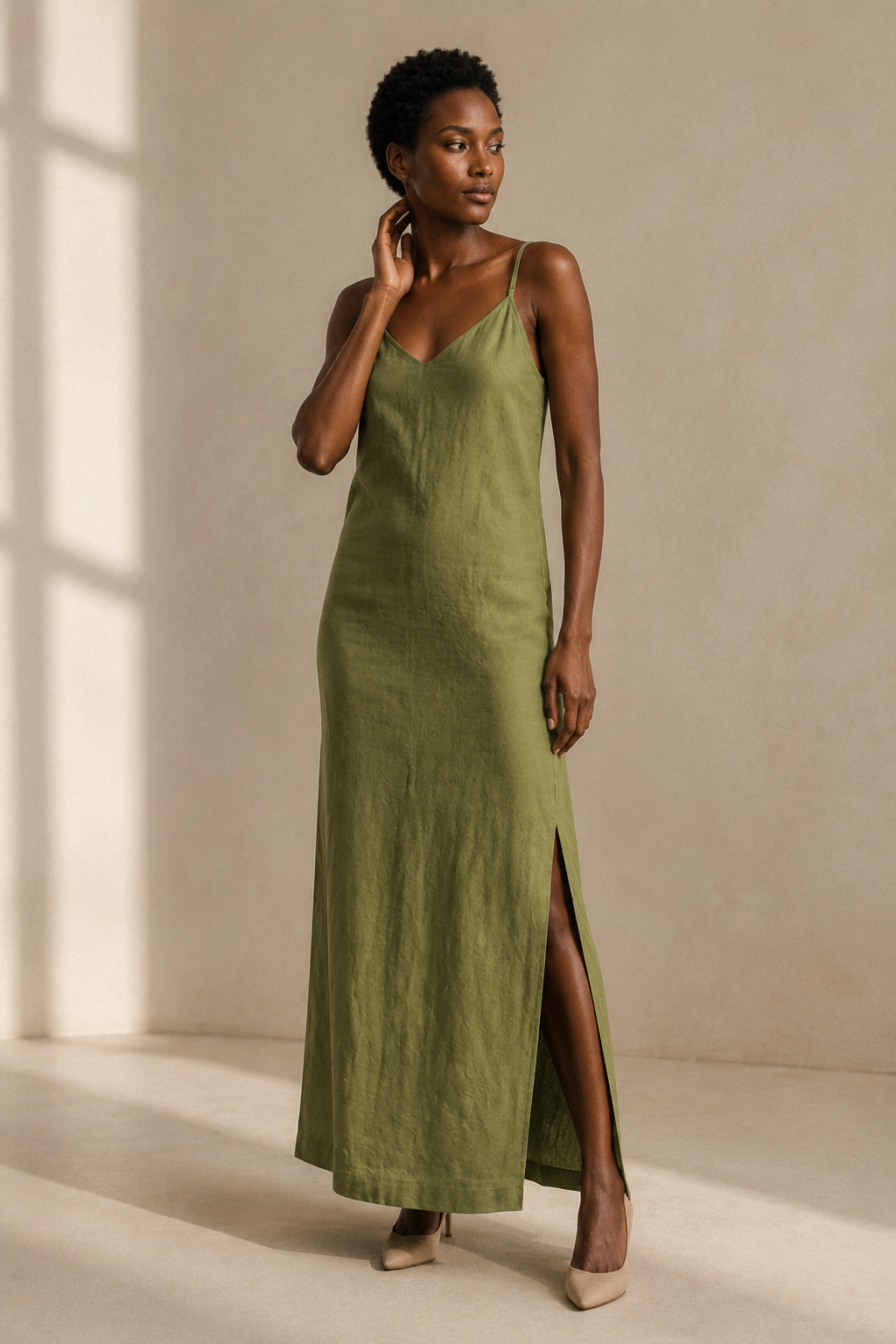 Olive green linen slip maxi dress, three-quarter view, relaxed silhouette, natural linen texture