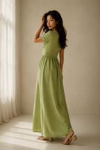 Light green linen a-line maxi dress, three-quarter view, flowing maxi dress and short sleeves