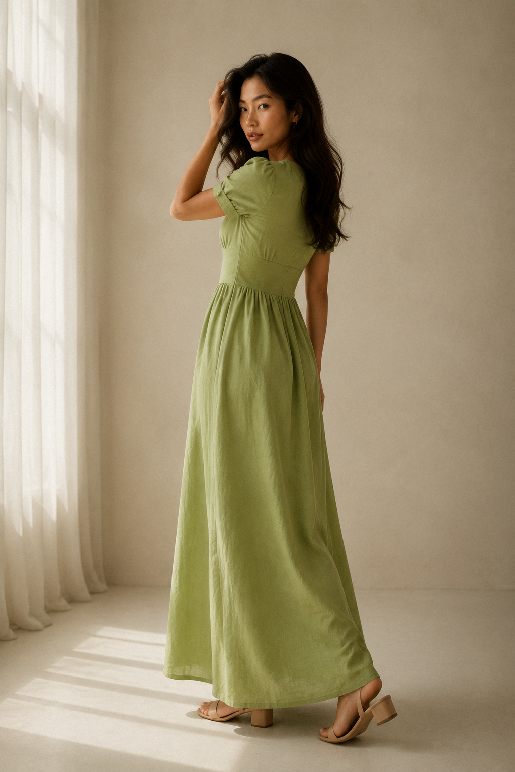 Light green linen a-line maxi dress, three-quarter view, flowing maxi dress and short sleeves