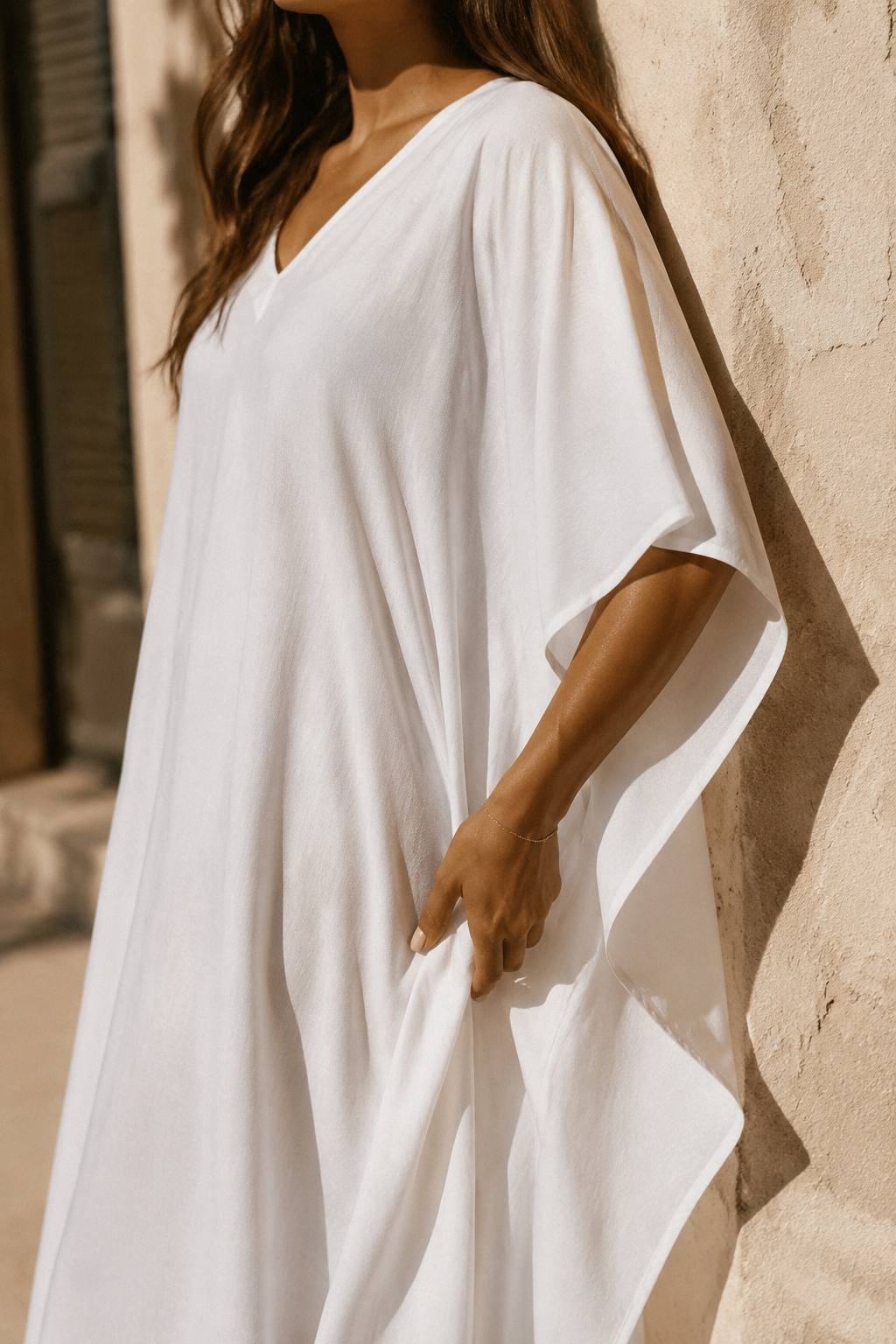 White cotton caftan maxi dress, fabric detail, cotton weave in raking light