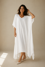 White cotton caftan maxi dress, full front view, flowing maxi dress with high-low hem