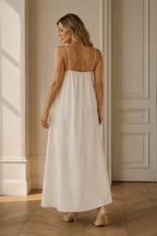 Ivory linen slip maxi dress, back view, flowing skirt