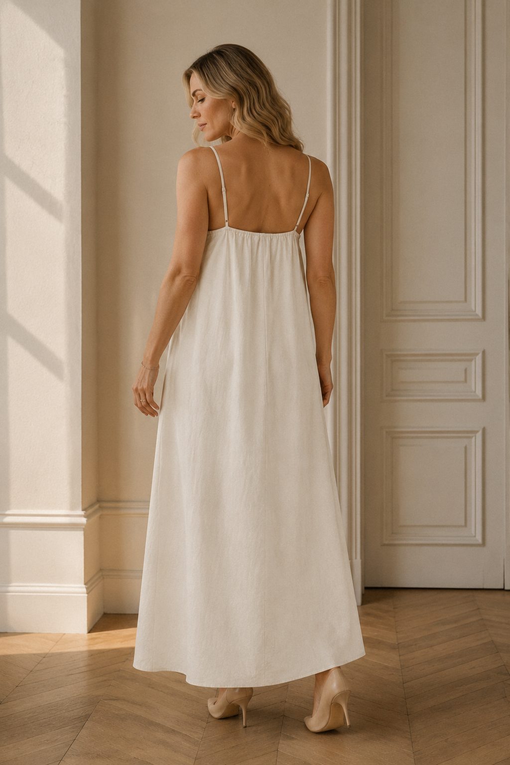 Ivory linen slip maxi dress, back view, flowing skirt