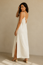 Ivory linen slip maxi dress, three-quarter view, flowing skirt and comfortable sandals