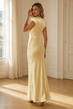 Butter yellow silk column maxi dress, three-quarter view, soft silk and graceful movement