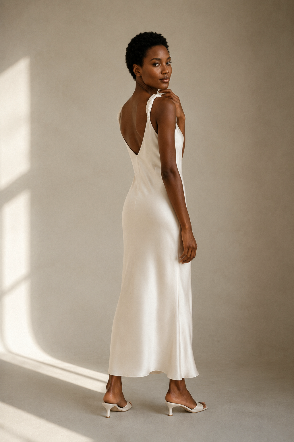 Ivory silk slip maxi dress, three-quarter view, soft drape of silk fabric