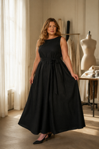 Black linen trapeze maxi dress, lifestyle, movement in a quiet setting