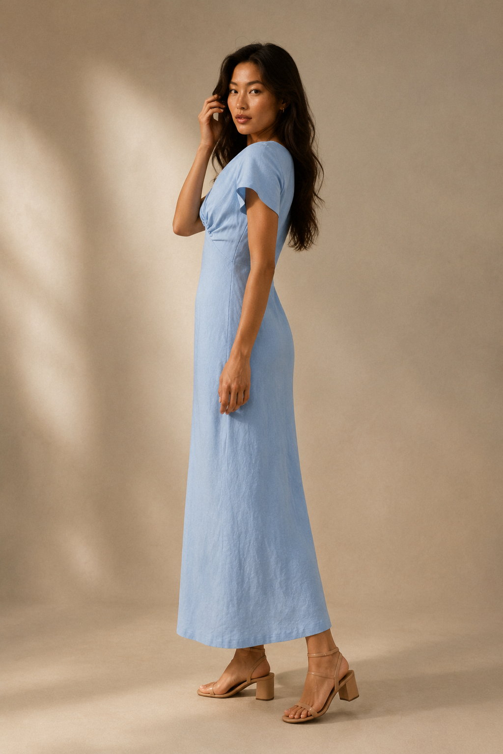 Light blue linen column maxi dress, three-quarter view, soft drape of linen fabric
