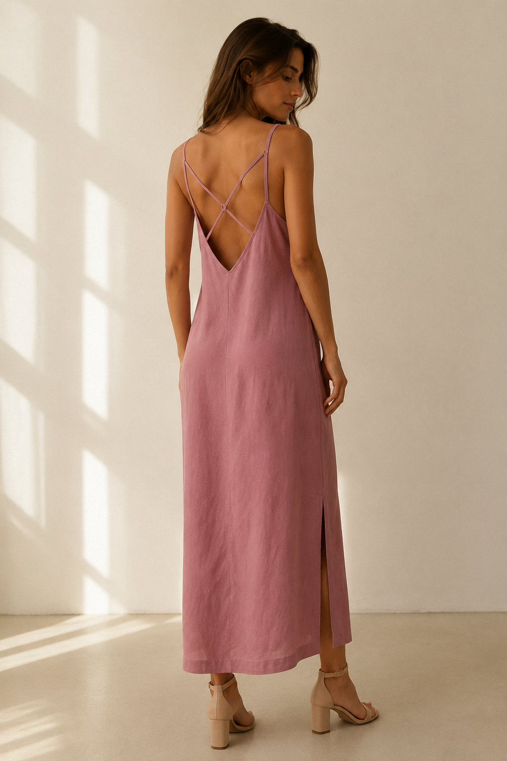 Dusty pink linen slip maxi dress, back view, deep V back and crisscross straps