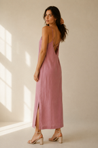 Dusty pink linen slip maxi dress, three-quarter view, crisscross back straps, side slit