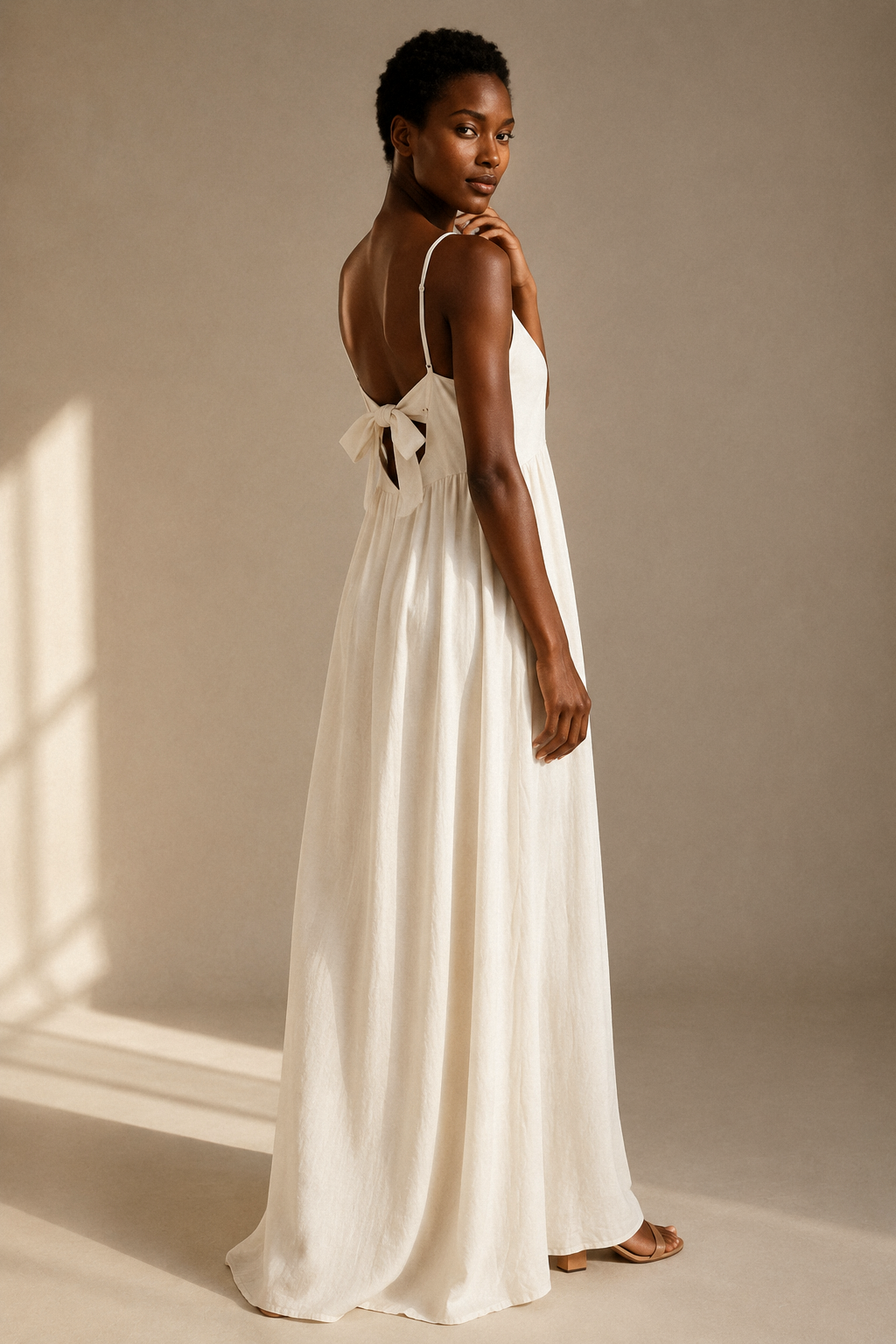 Ivory linen a-line maxi dress, three-quarter view, relaxed fit and natural fabric