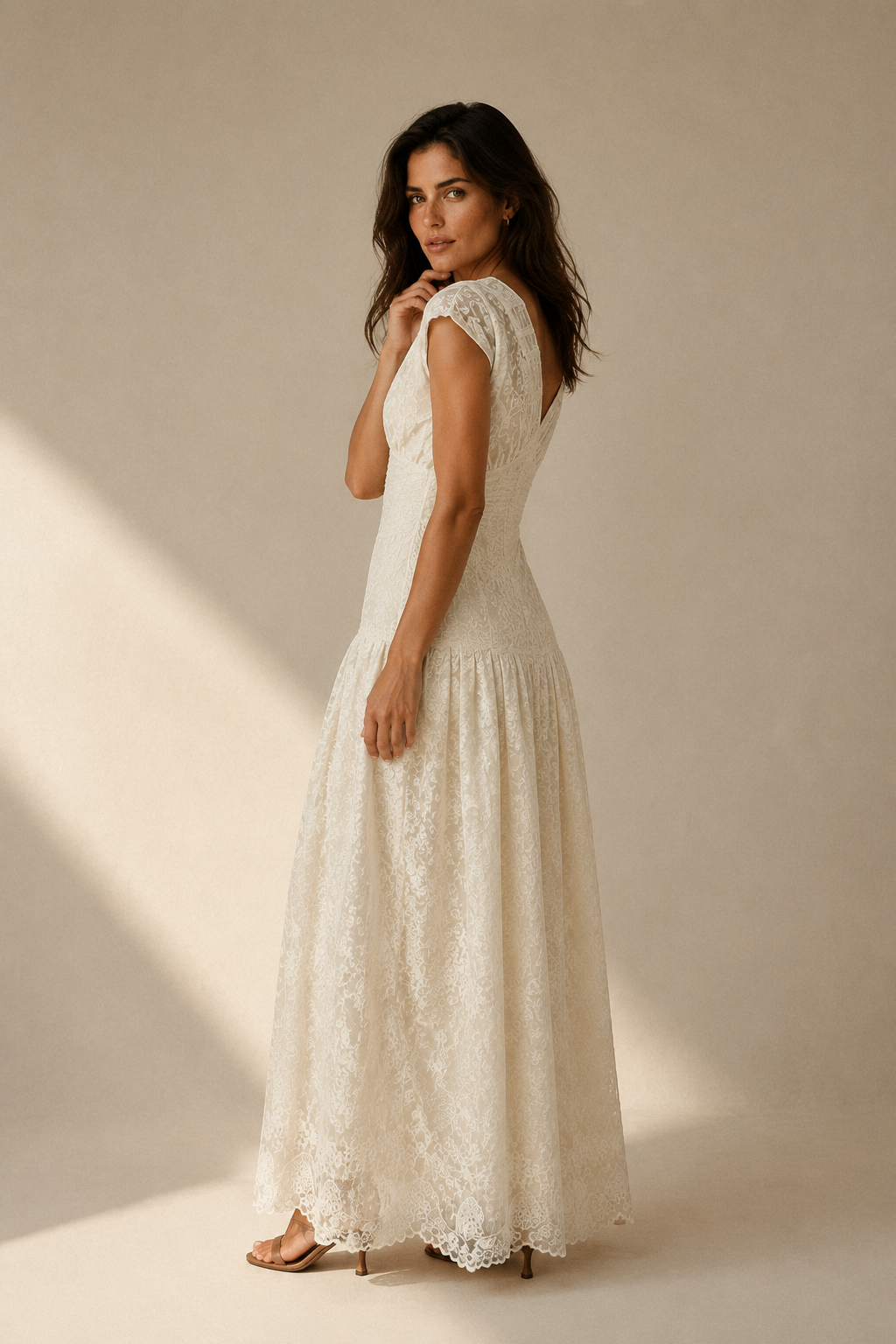 Ivory lace a-line maxi dress, three-quarter view, textured fabric and skirt drape