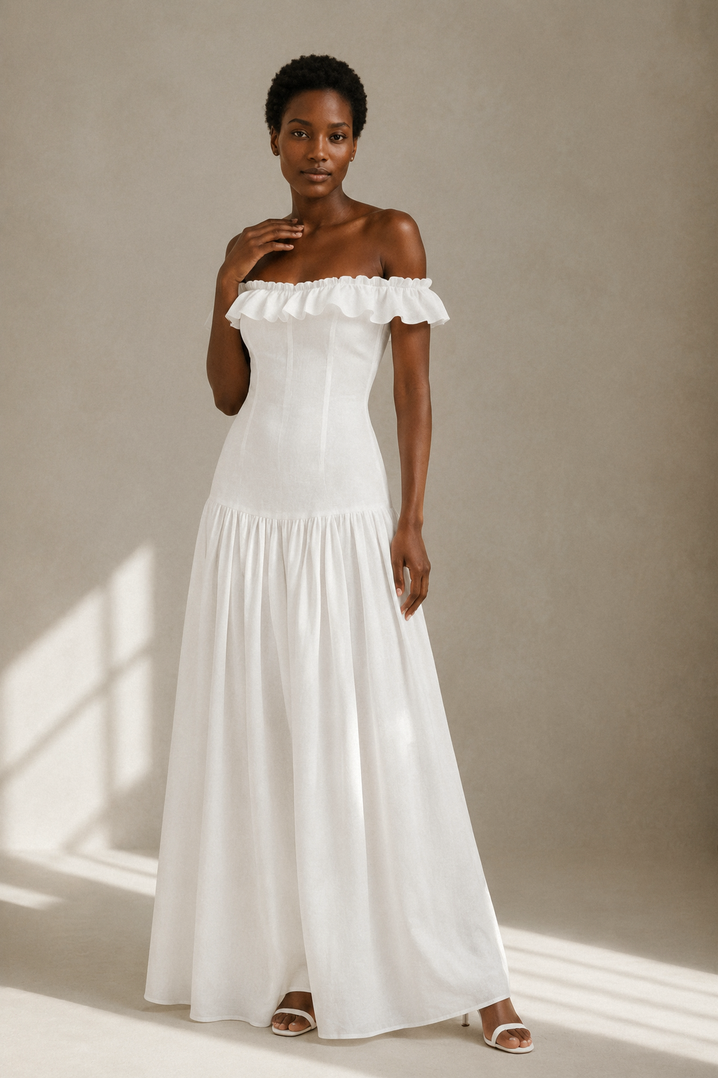 White linen a-line maxi dress, full front view, off-shoulder neckline, gathered waist, full maxi skirt