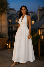 White linen a-line maxi dress, lifestyle, strolling on a sunlit afternoon