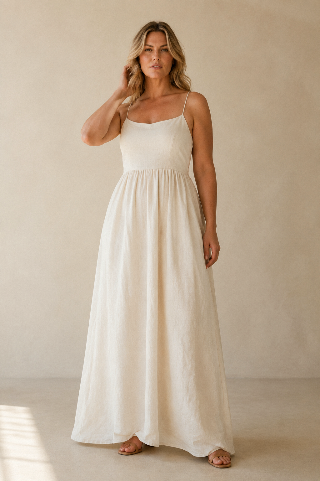 Ivory linen a-line maxi dress, full front view, gathered waist and flowing skirt